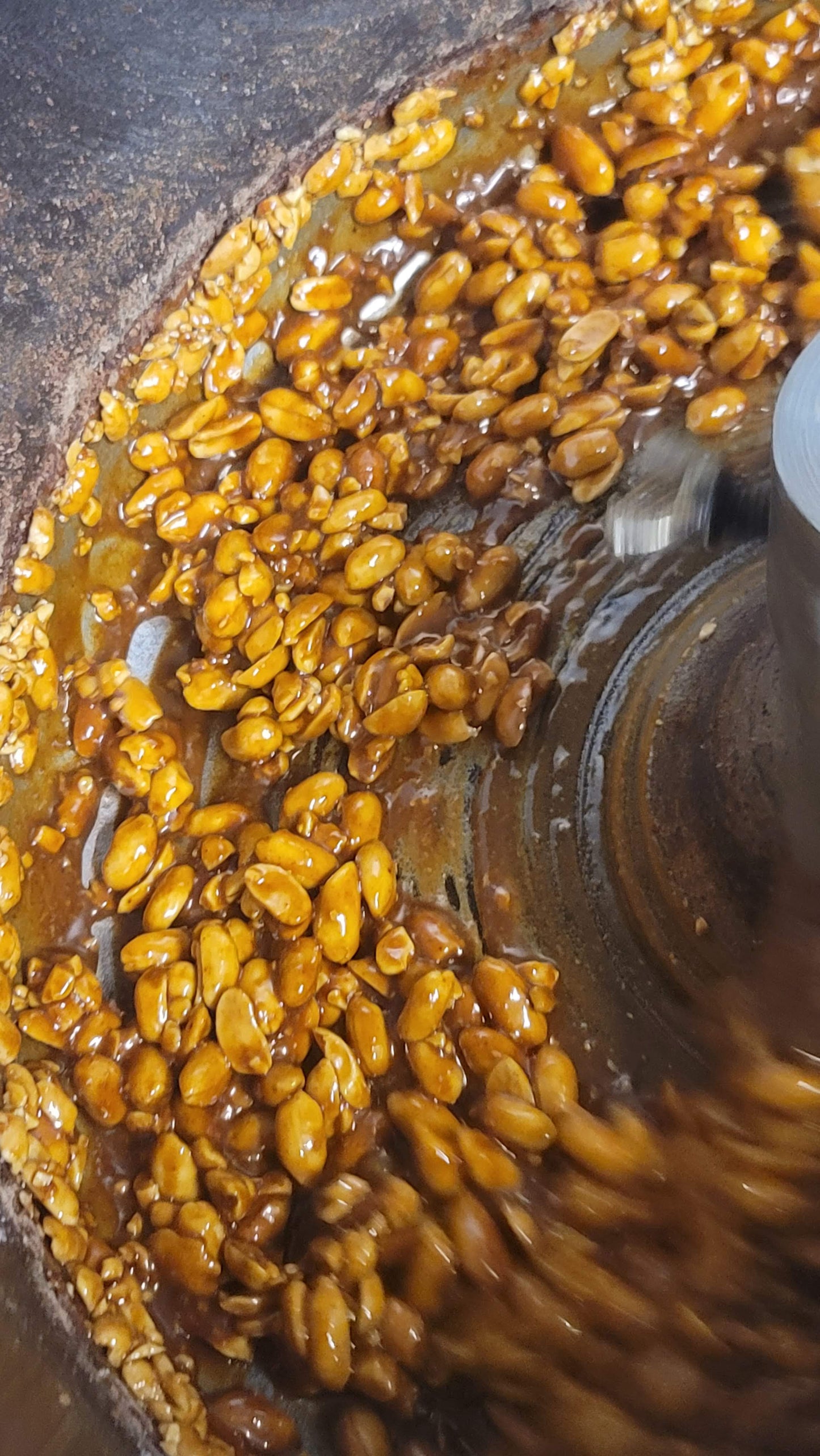 cinnamon roasted almonds roasting in pralinator